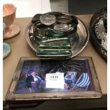 A silver photograph frame, two glass salts with silver bases, a glass bowl with silver rim (no lid),