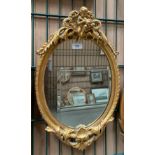 Ornate gilt framed wall mirror,