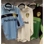 Three various Packard Bell sponsors Leeds United shirts/tops,