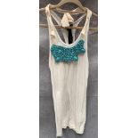 A Poleci ladies vest top, white with turquoise necklace, one size,