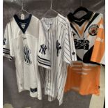 A Castleford Tigers Safestyle UK rugby league shirt, size S and two New York Yankee baseball shirts,