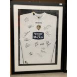 Leeds United Interest: A framed and mounted Diadora White and Mackay Leeds United shirt,