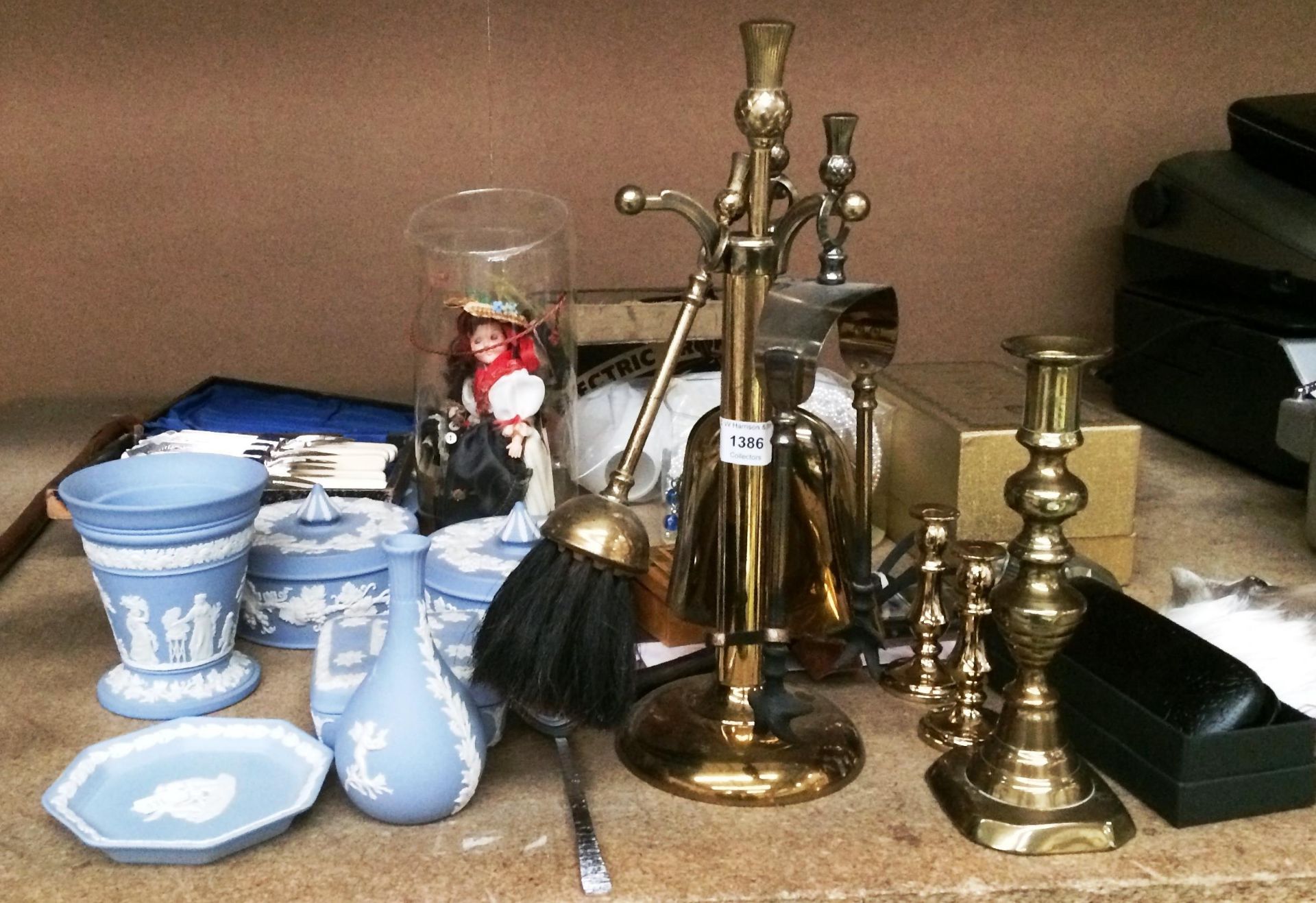 Contents to part of rack brass fireside companion, pieces of blue Wedgwood, brass candlesticks,
