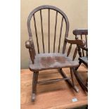 A mahogany finish Windsor style child's rocking chair