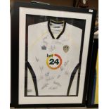 Leeds United Interest: A framed and mounted Admiral Bet 24 Leeds United shirt,