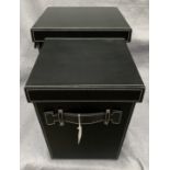 Two graduated black leather finish boxes,