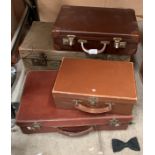 Four various brown fibre suitcases