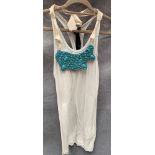 A Poleci ladies vest top, white with turquoise necklace, one size,