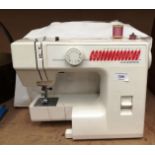 A Janome JS 1004 portable sewing machine, no lead, complete with cover (not PAT tested,