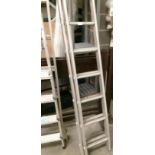 An aluminium 32 rung double extension ladder