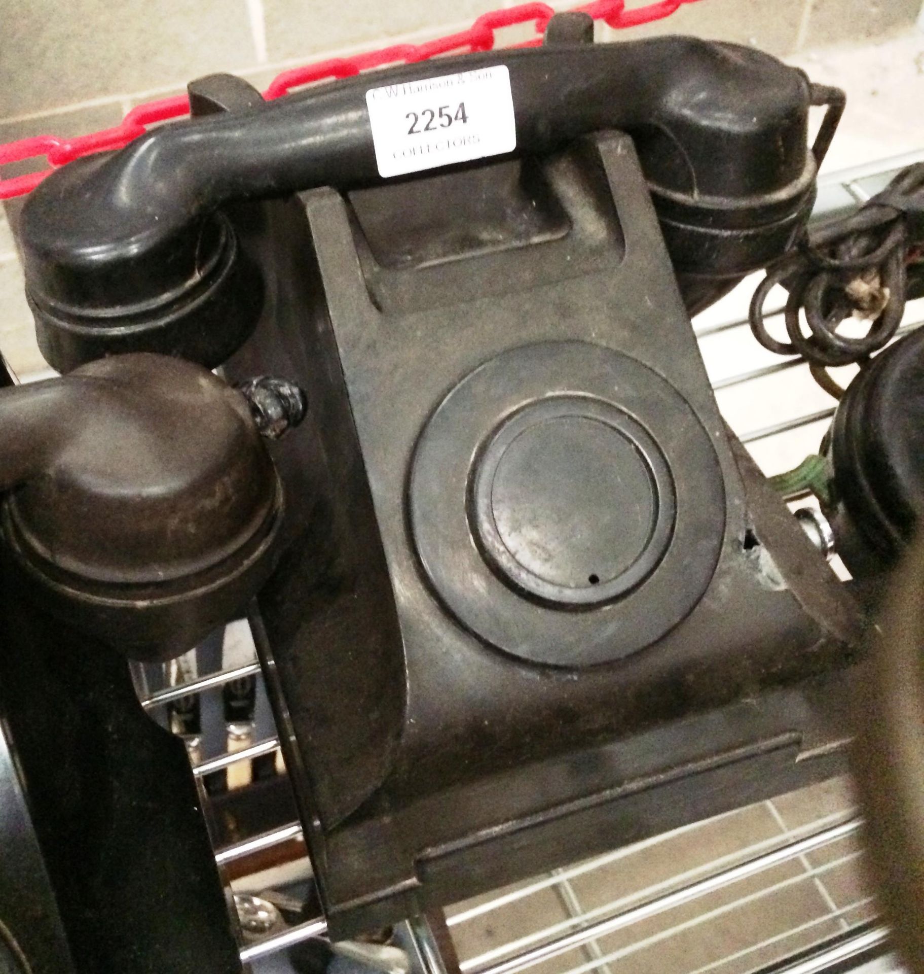 A black bakelite magneto telephone