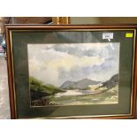 A small framed watercolour lake and mountain scene 23 x 34cm