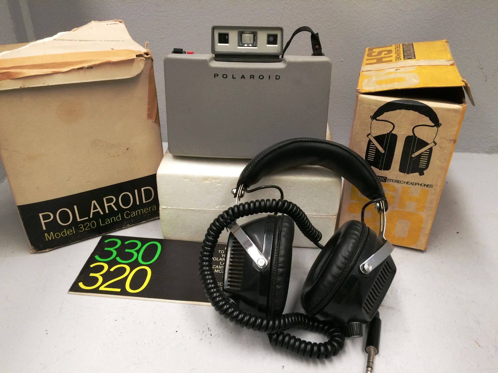 2 x items - Polaroid 320 land camera and Audiotronic LSH 30 headphones
