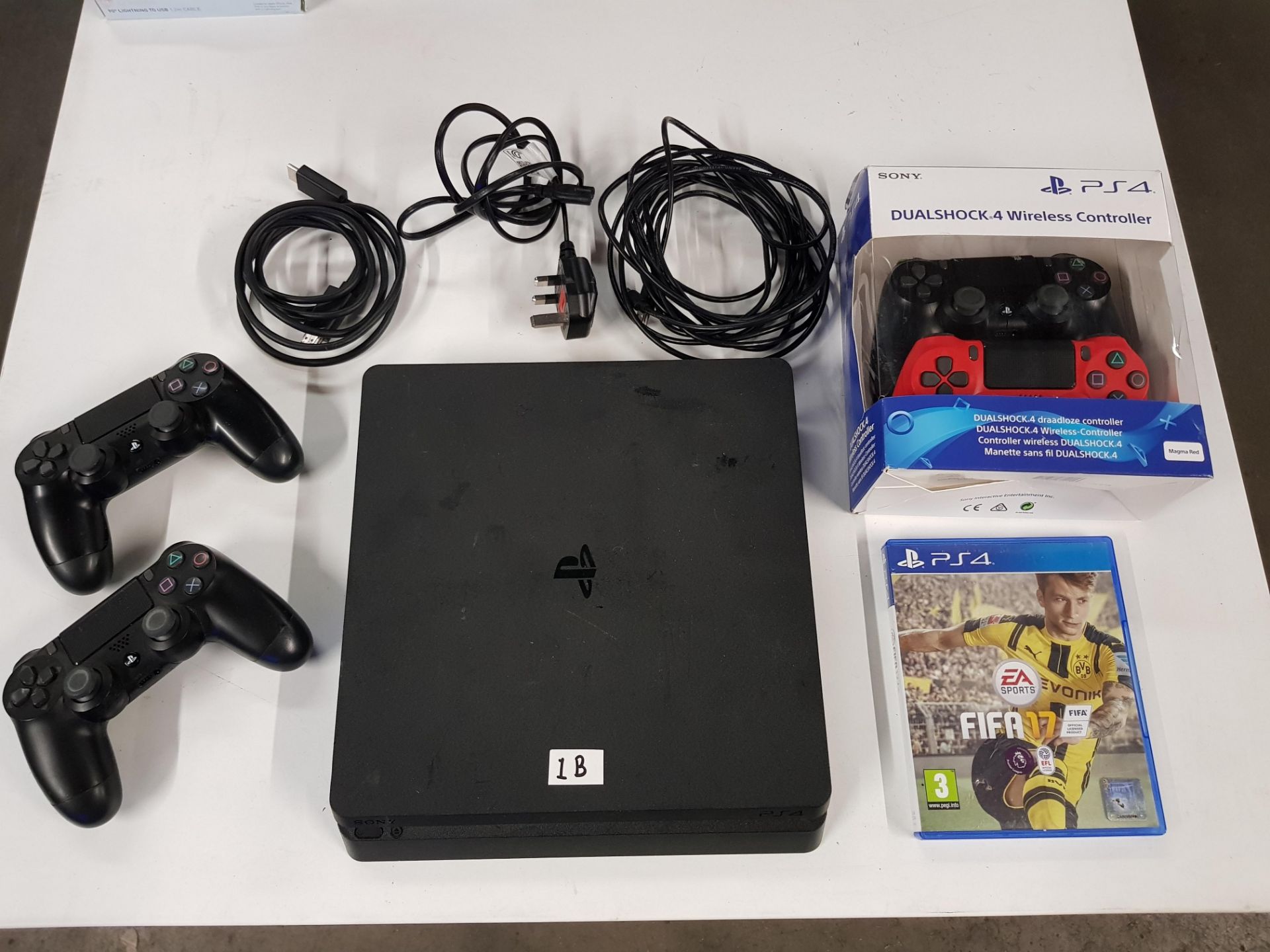 Sony PS4 with 4 controllers & 1 game.