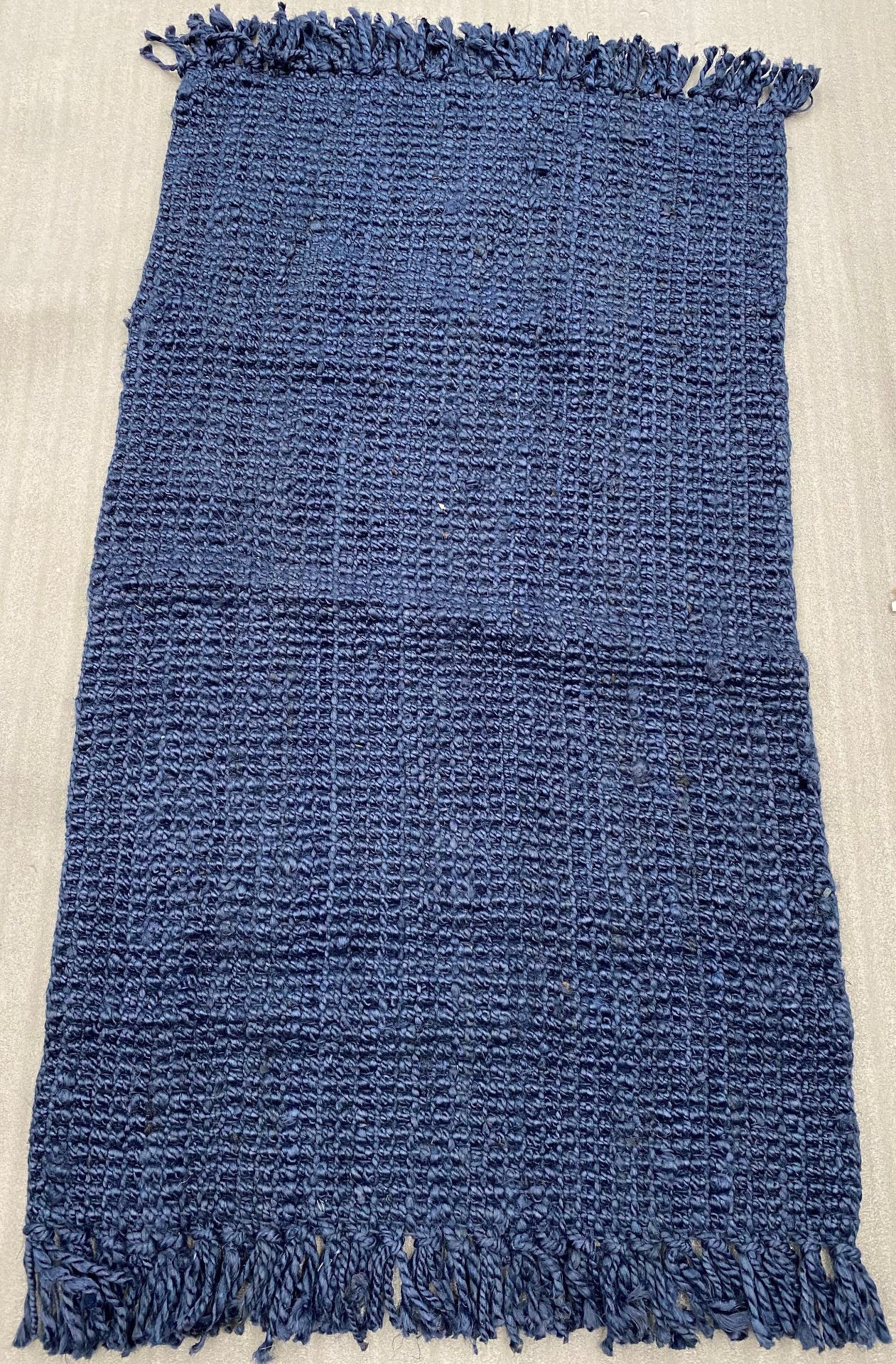 A Woven Blue rug - 170cm x 90cm