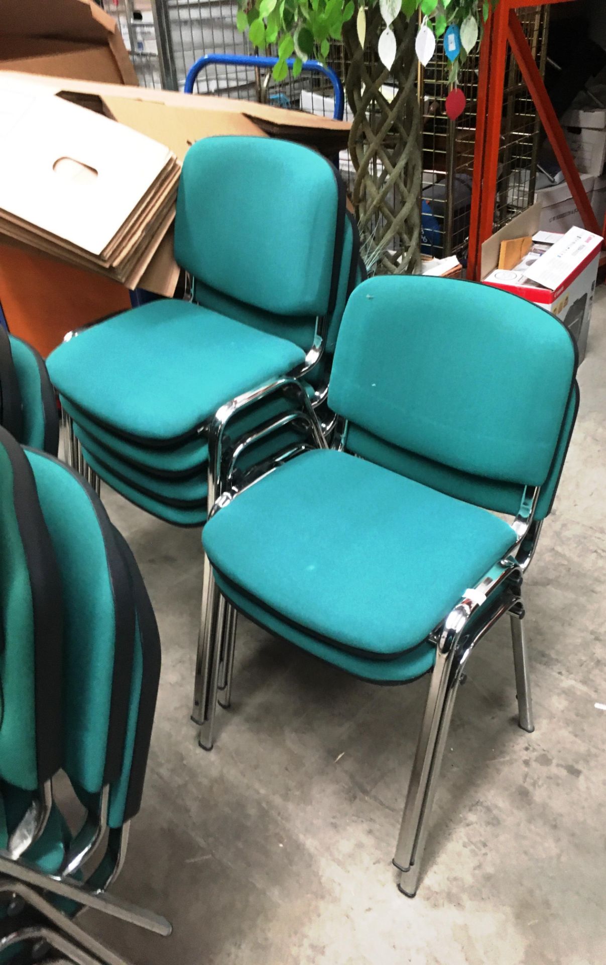 Six chrome framed green cloth upholstered office stacking chairs