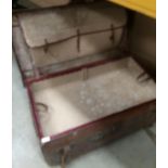 A distressed brown leather trunk with inner tray,