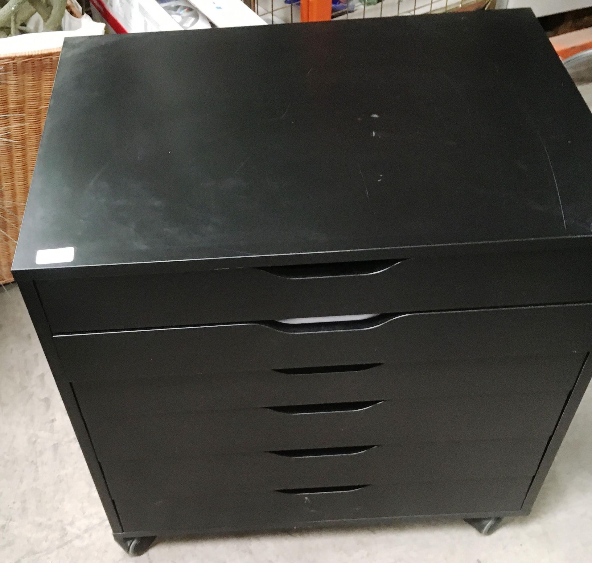 A black melamine 6 drawer mobile office cabinet and any contents - clear files, paper etc.