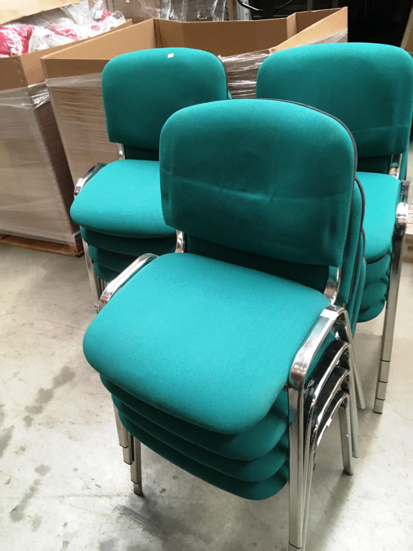 Twelve chrome framed green cloth upholstered office stacking chairs - slight shade variation