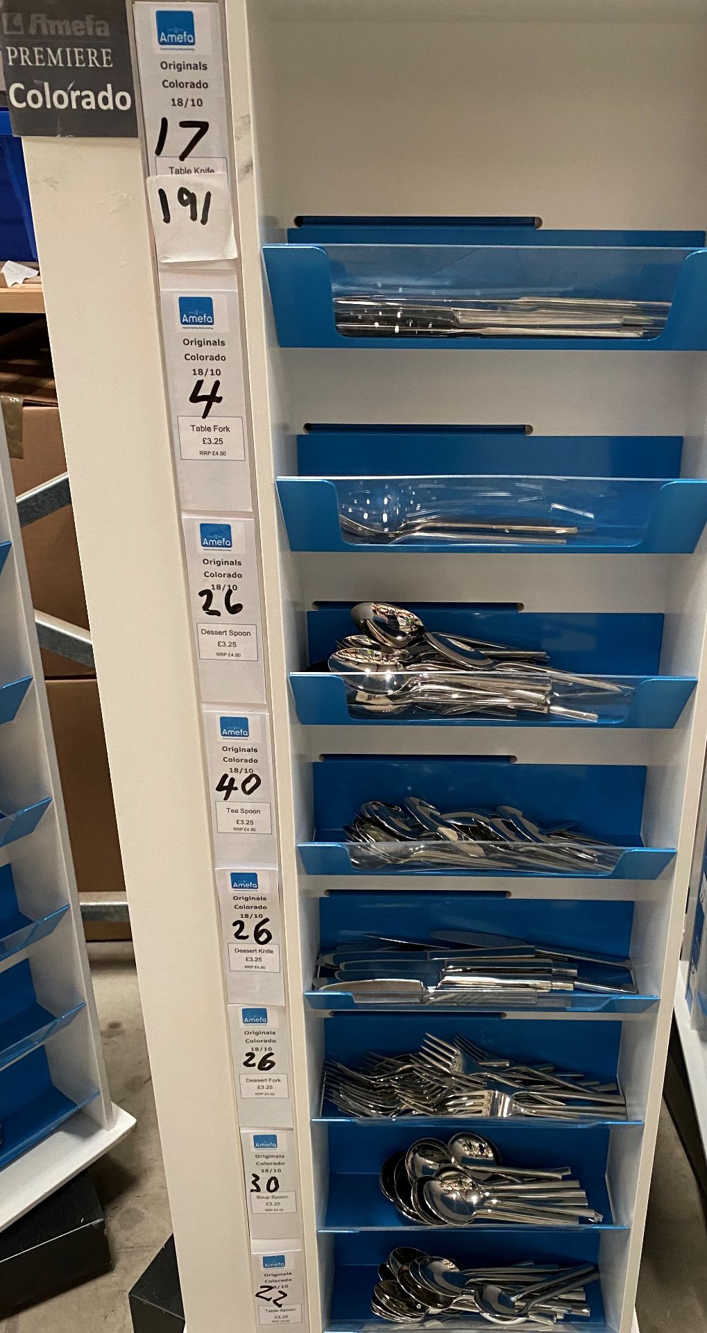 Contents to one side of an 8 shelf display - 191 pieces of Amefa Colorado cutlery - including