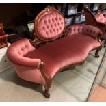 A mahogany framed Edwardian style parlour room settee upholstered in deep buttoned pink dralon