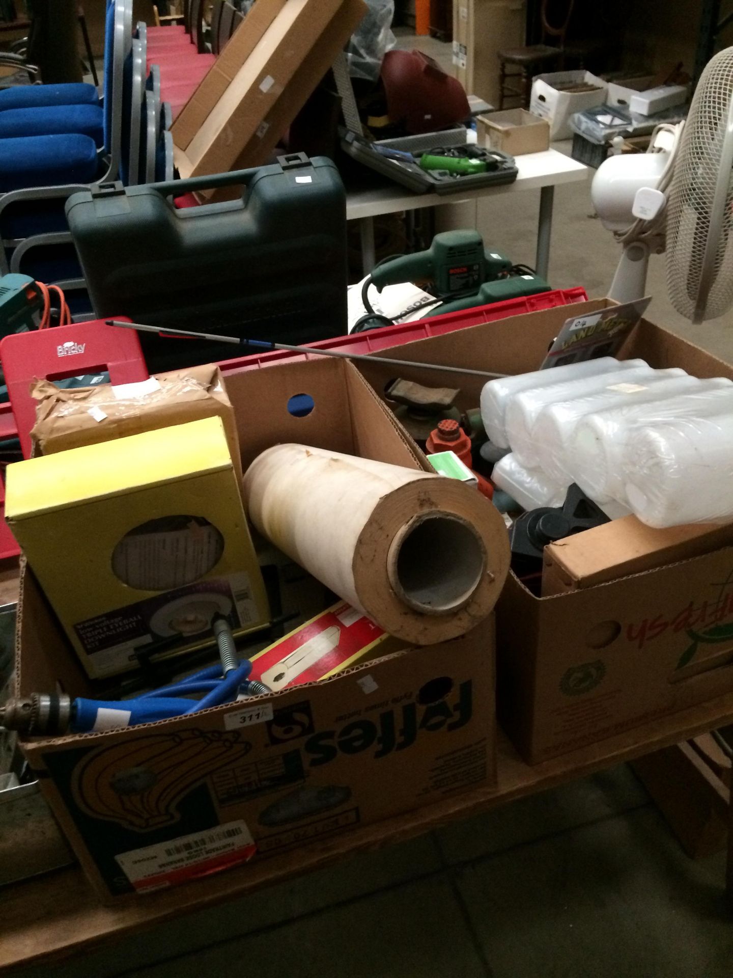 Contents to two boxes - saws, bottle jacks, adaptors, a Bricky plastic level, lights,