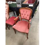 A dark wood finish armchair with pink dralon upholstery and a Caxton Furniture mahogany finish