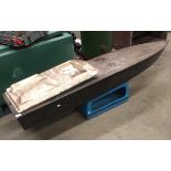 A fibreglass model speedboat, 183cm long complete with a remote control but no fittings,