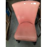 A salmon pink upholstered bedroom chair [Please note - the upholstery in this lot does not comply