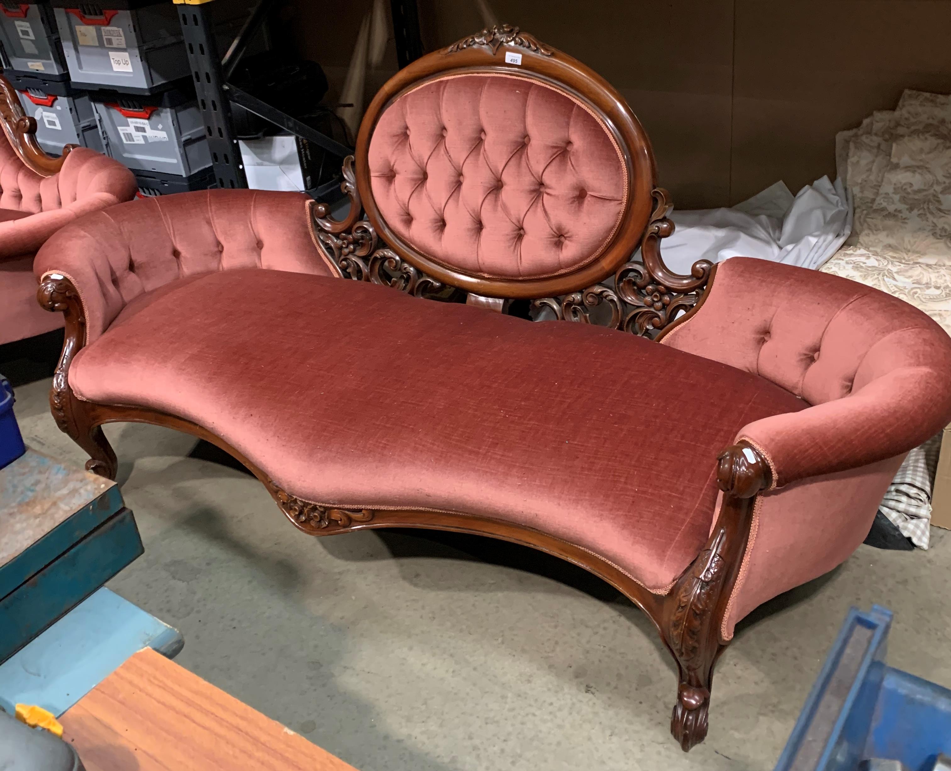 A mahogany framed Edwardian style parlour room settee upholstered in deep buttoned pink dralon
