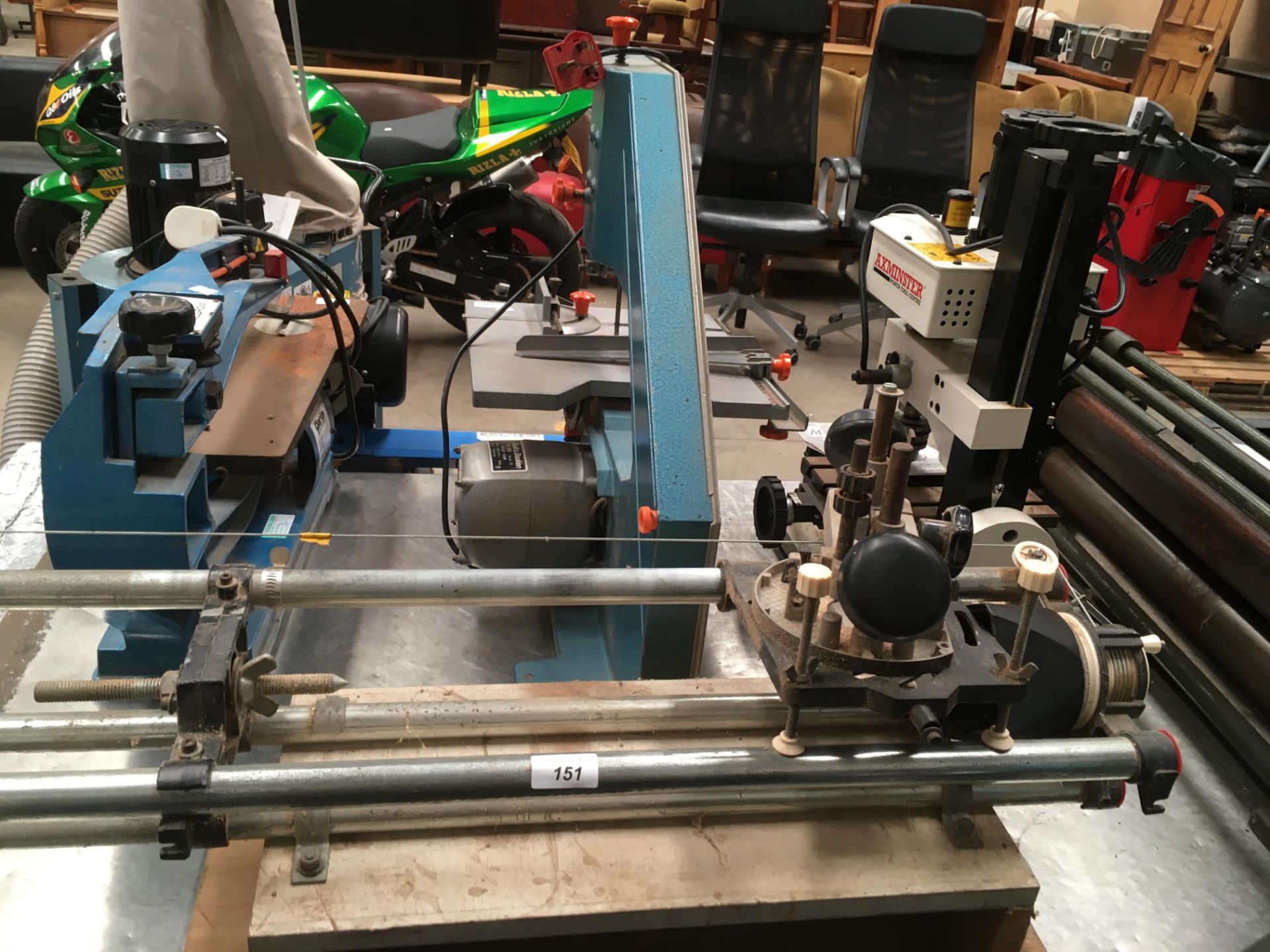 An adjustable Bosch router clamp on tabular metal frame