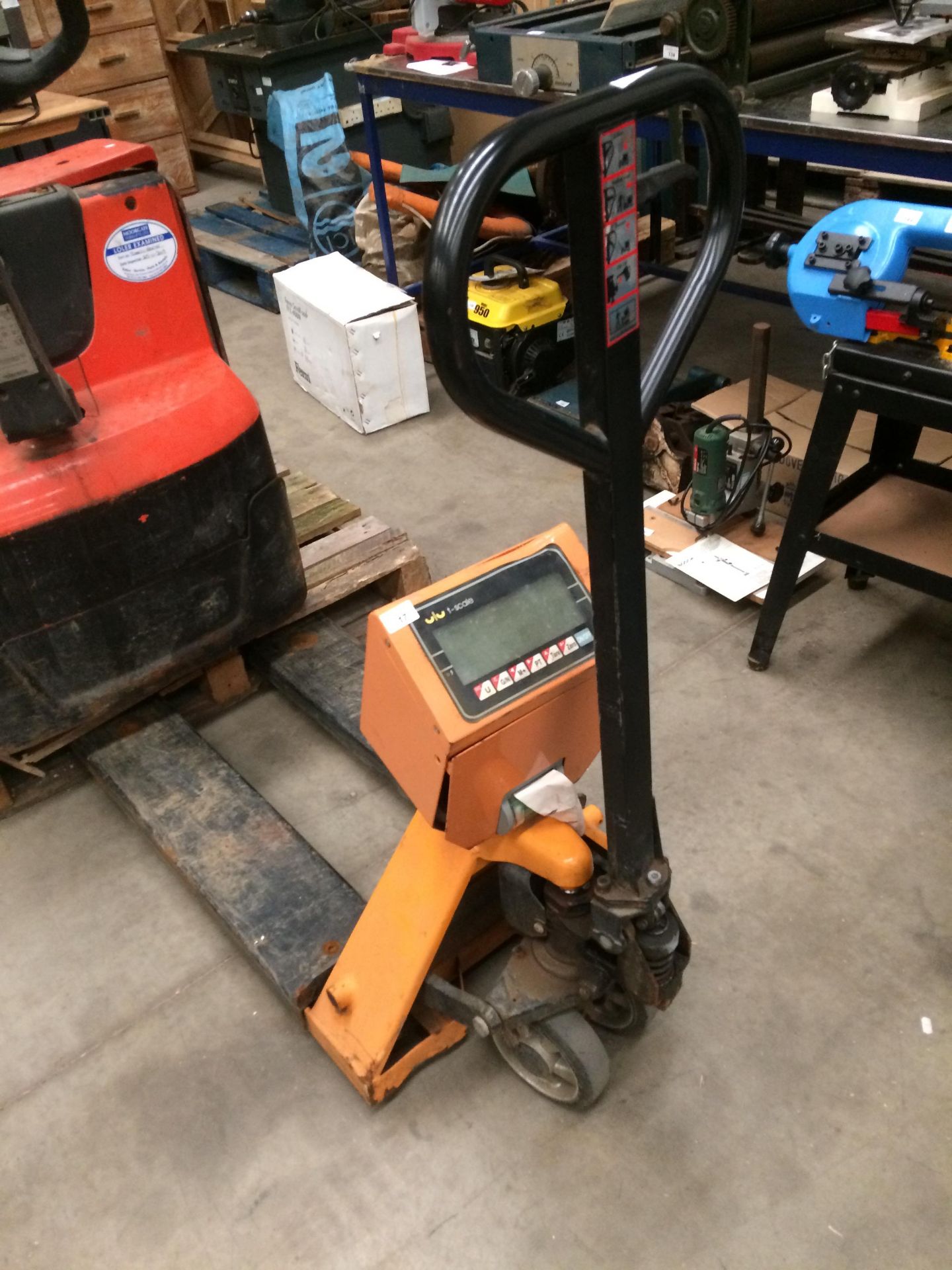 An orange and black metal pallet truck fitted with a U/UT - scales model TPS-11 with digital