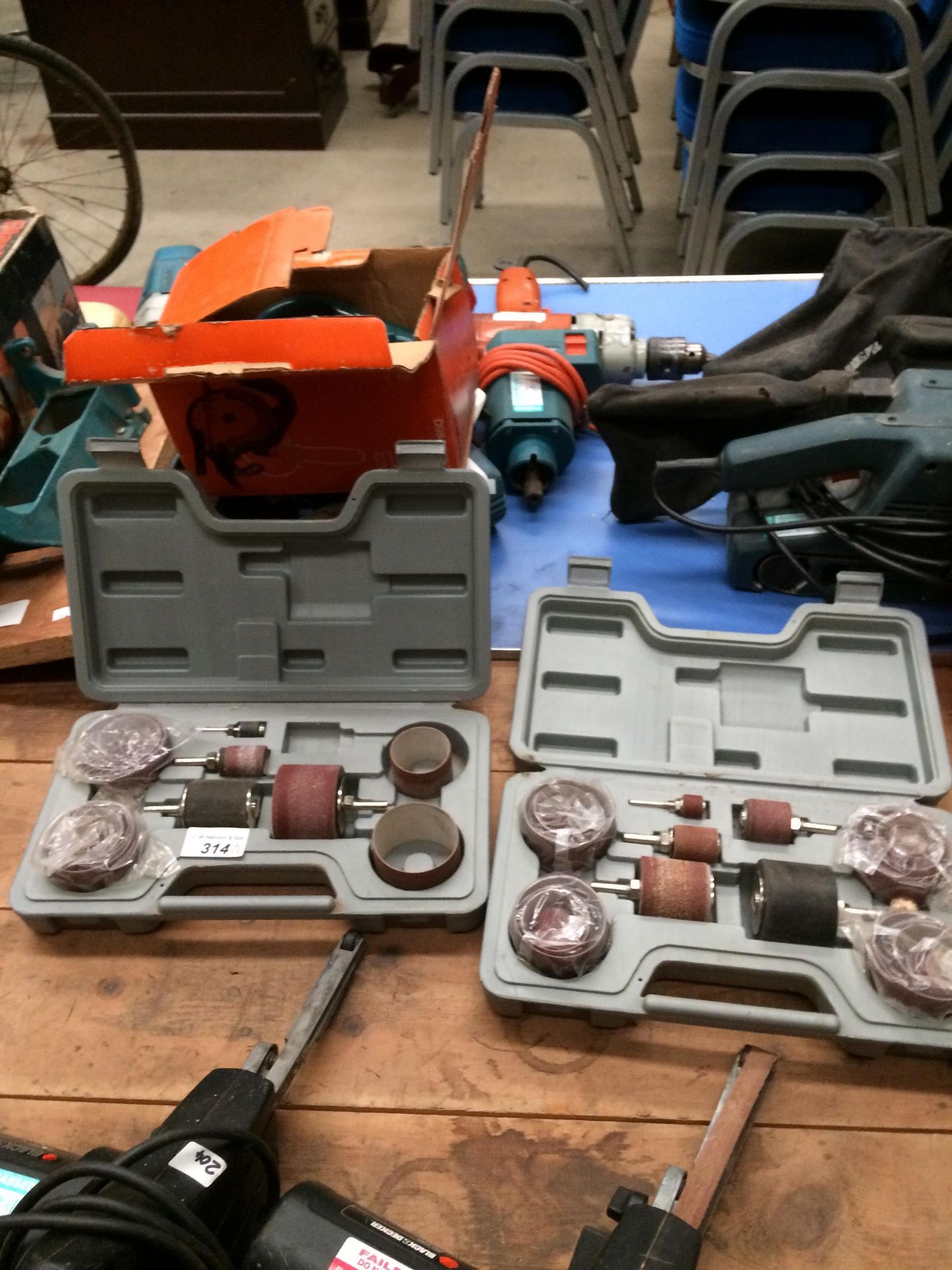 Two cased sanding attachment sets