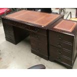A mahogany finish reproduction 8 drawer (one two drawer dummy) twin pedestal desk with brown