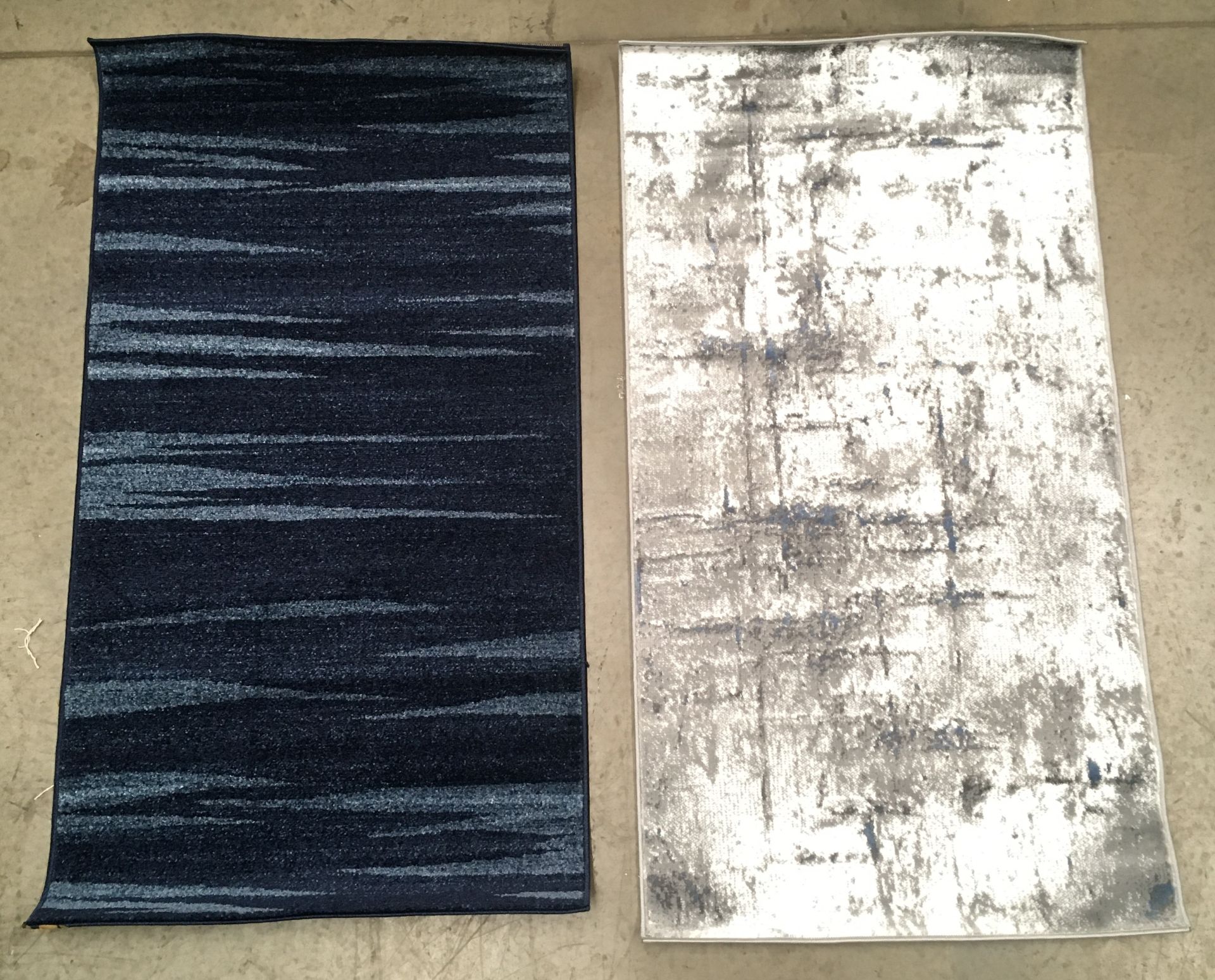 A Tapiso Rasta dark blue rug - 80cm x 150 and a Inspiration 8025 grey rug - 80cm x 150cm