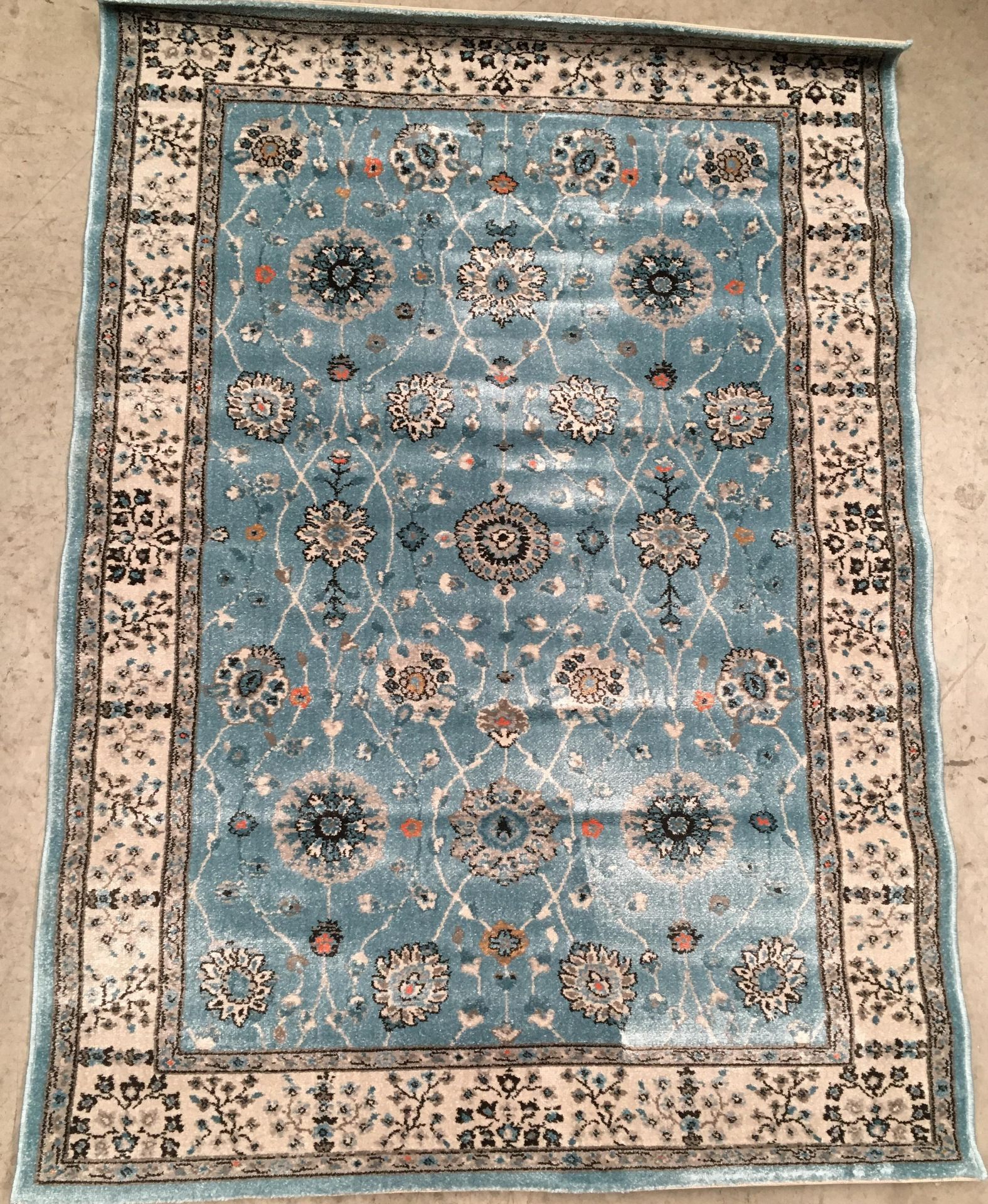 An Oriental style rug in light blue,