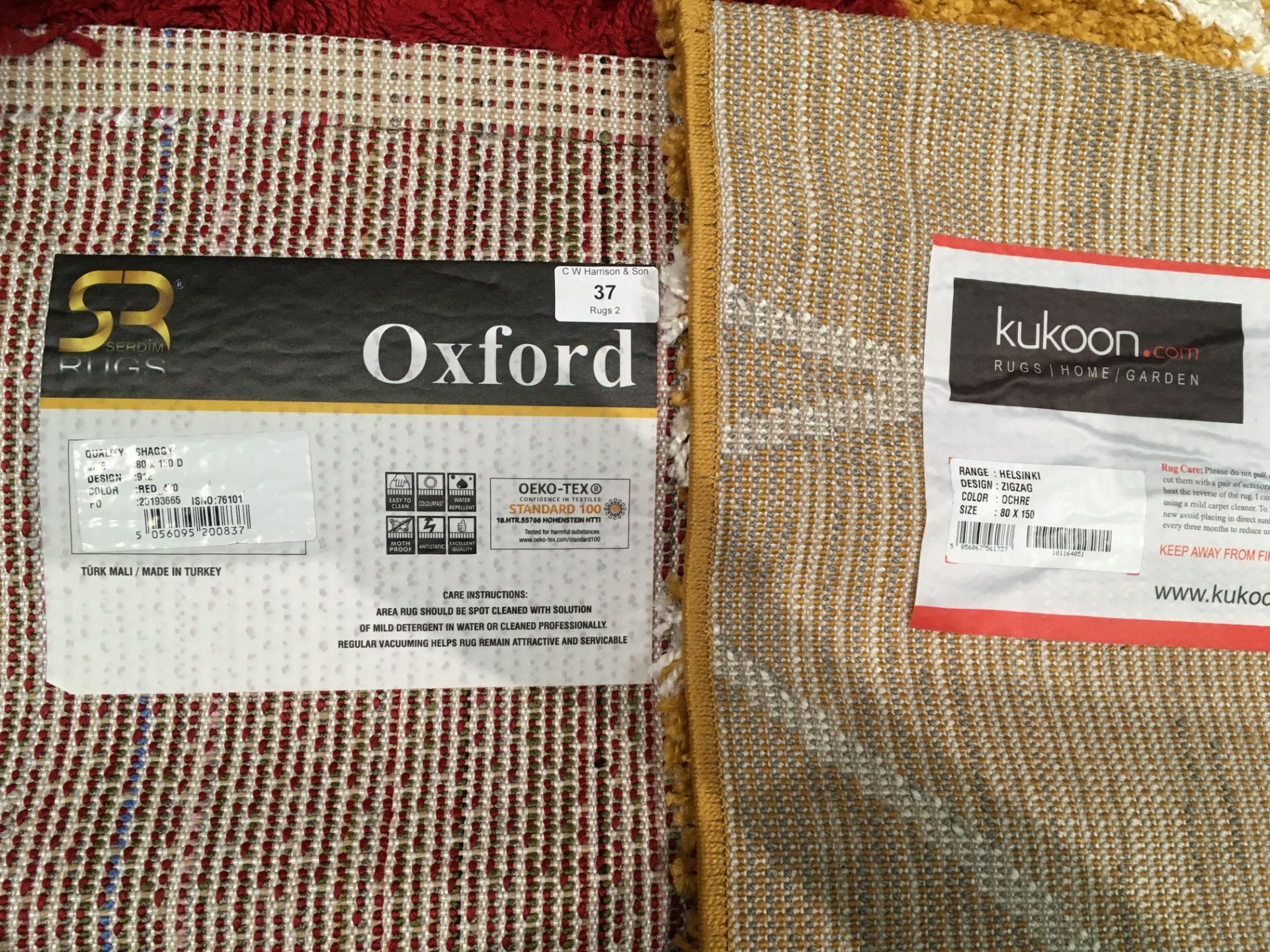 A Oxford shaggy red rug - 80cm x 150cm and a Kukoon. - Image 2 of 2