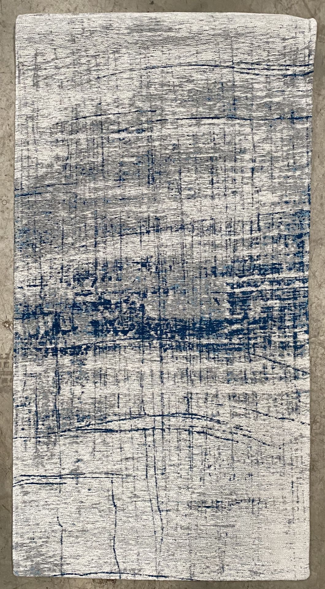 A Louis De Poortere Mad Men Collection Bronx Azurite antislip rug - 80cm x 150cm