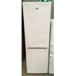 A Beko CSG1571W upright fridge freezer