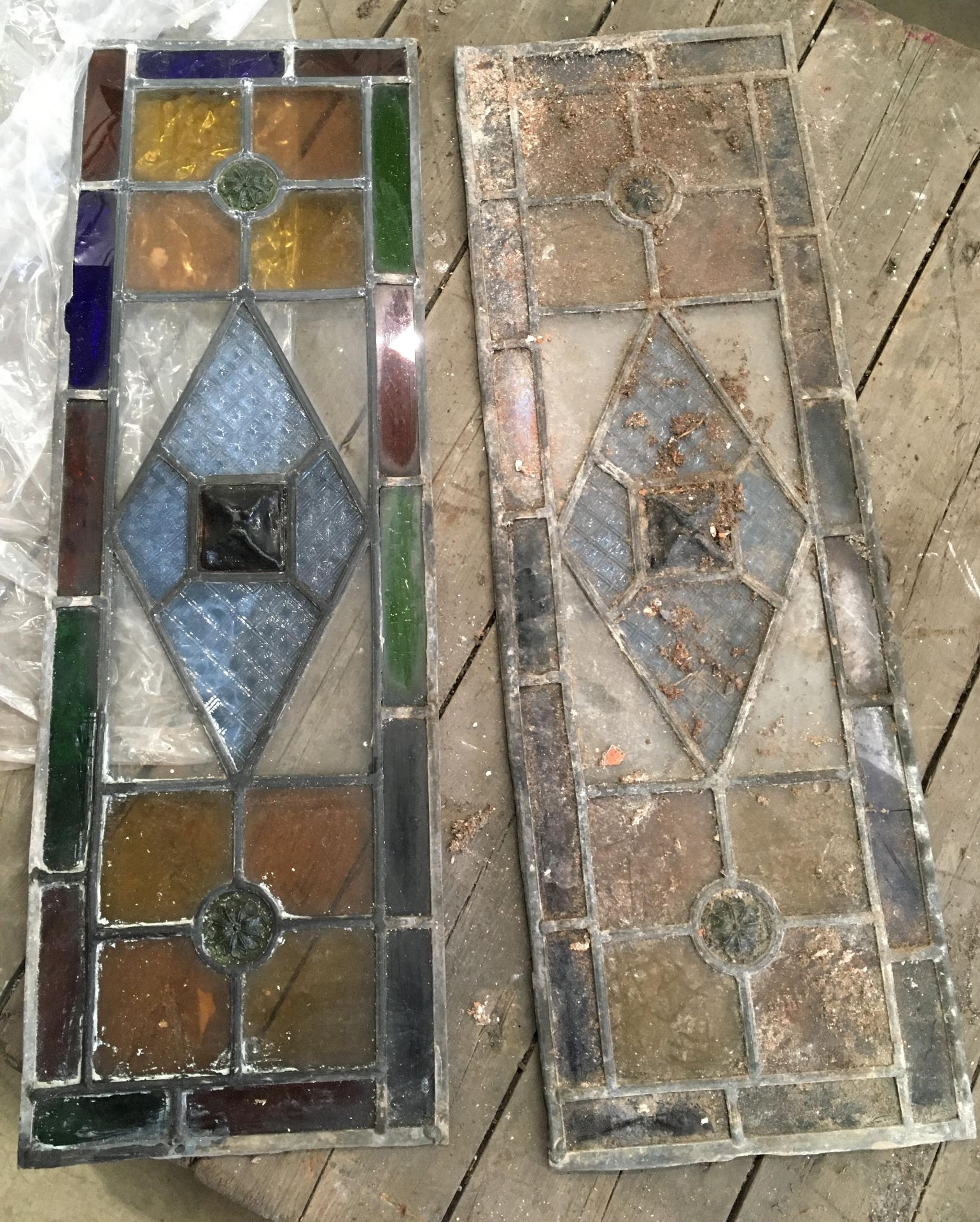 Two small panels of leaded coloured glass - some loose each 20 x 60cm