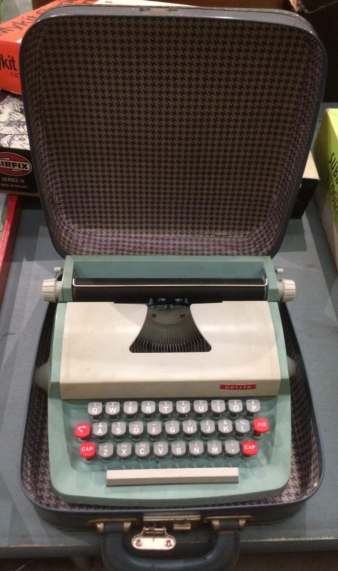 A child's Petite typewriter in carry case - case lock damaged