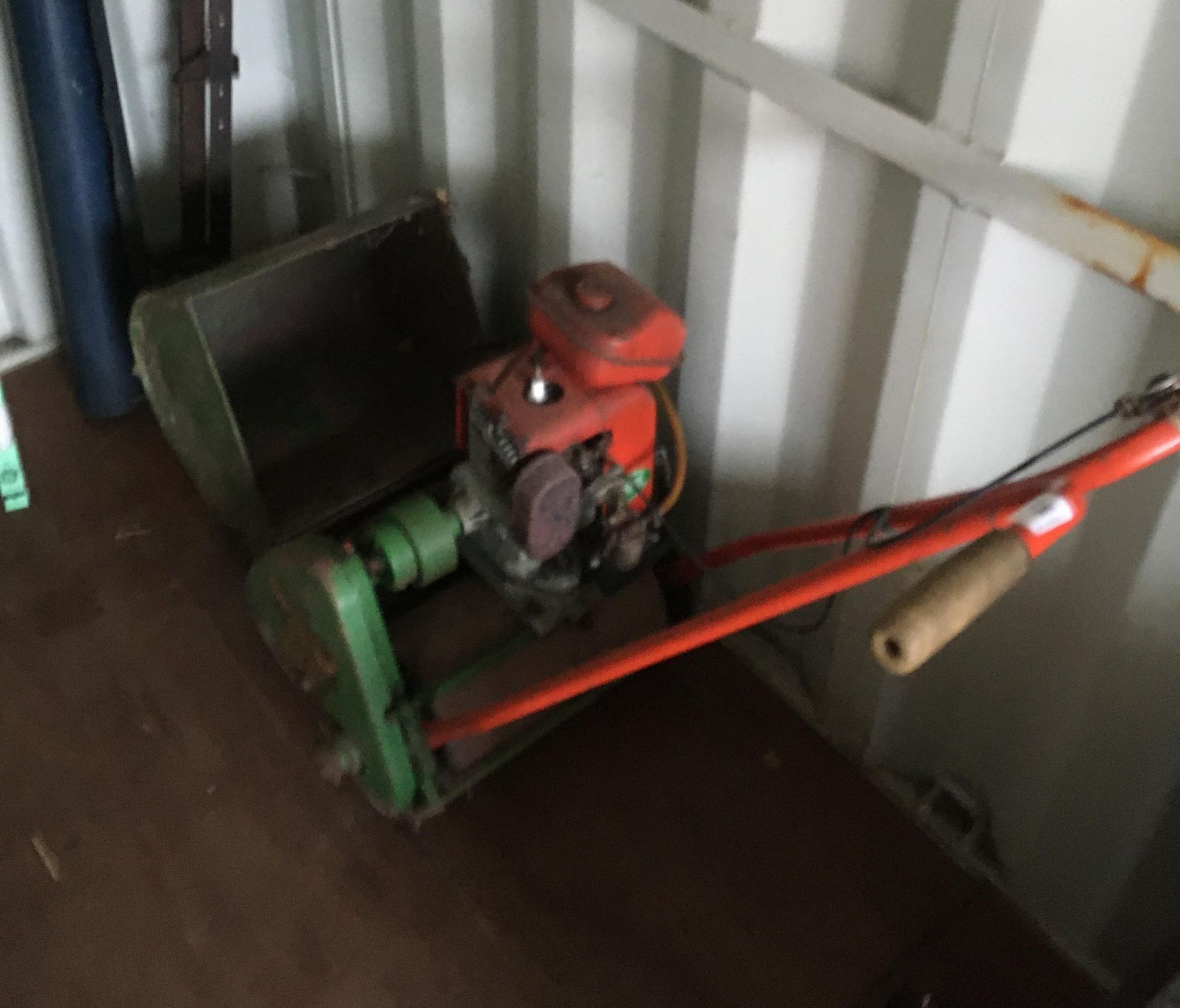 A Suffolk colt vintage petrol lawnmower complete with bucket