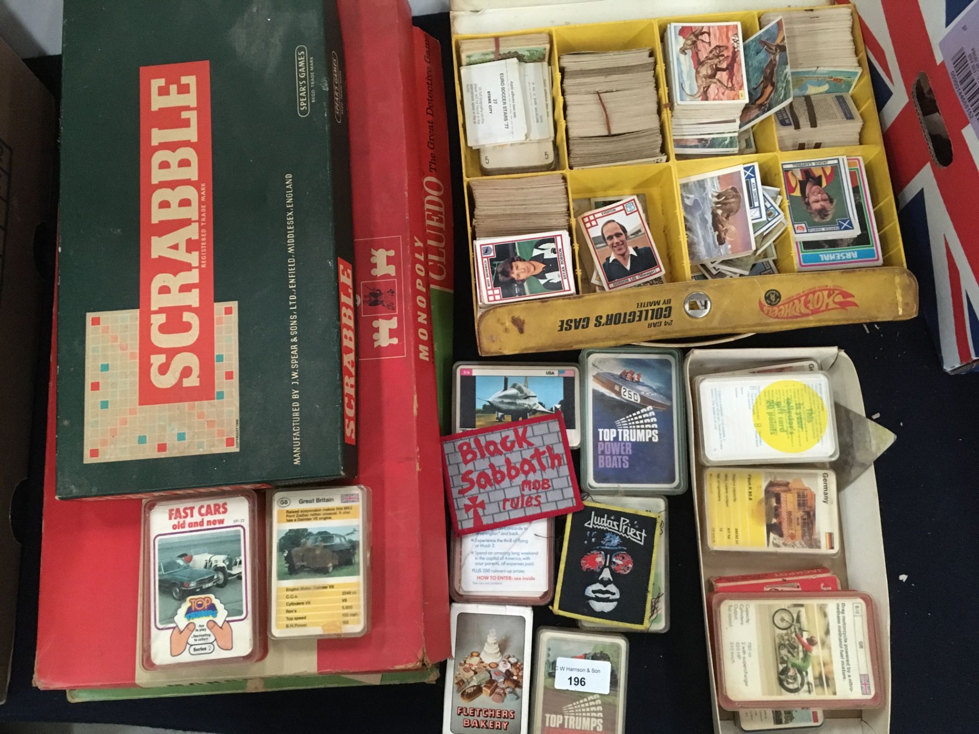 Cluedo, Monopoly and Scrabble boxed games, a collection of car,