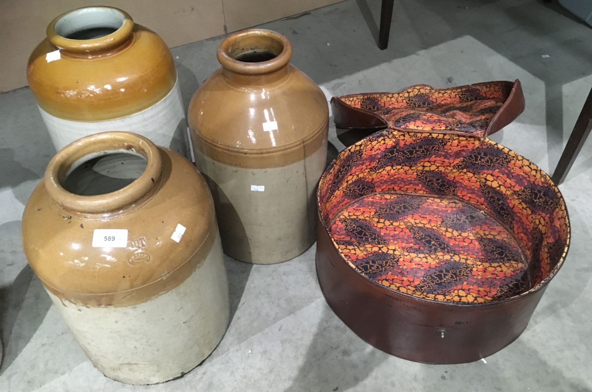 Three glazed stoneware storage jars and a hat box (4)