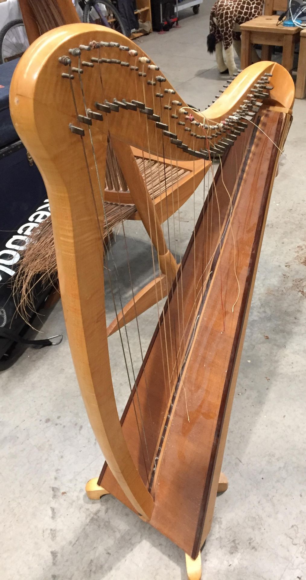 A polished wood framed harp approx 130cm high with damages