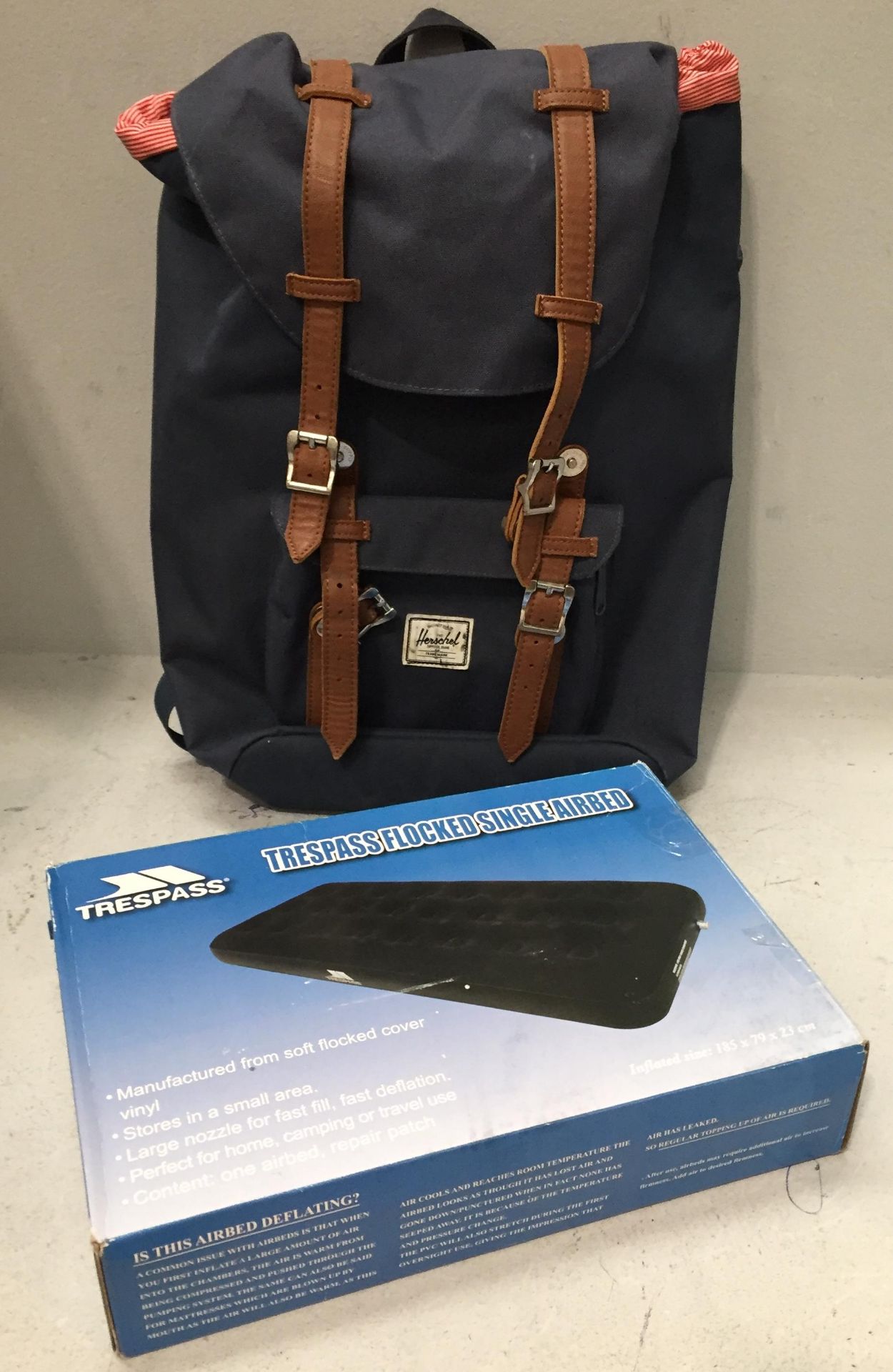 A Trespass Flocked single airbed (boxed) and a Herschel blue canvas rucksack (2)