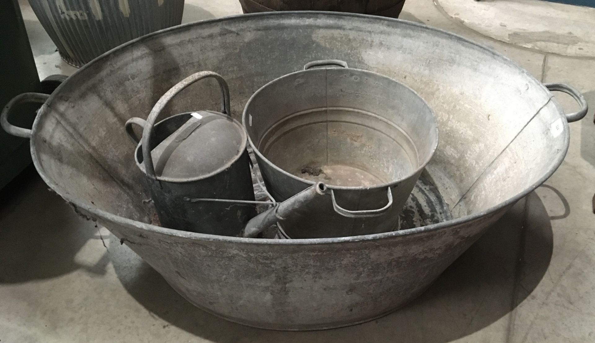 A galvanised two handled bath,