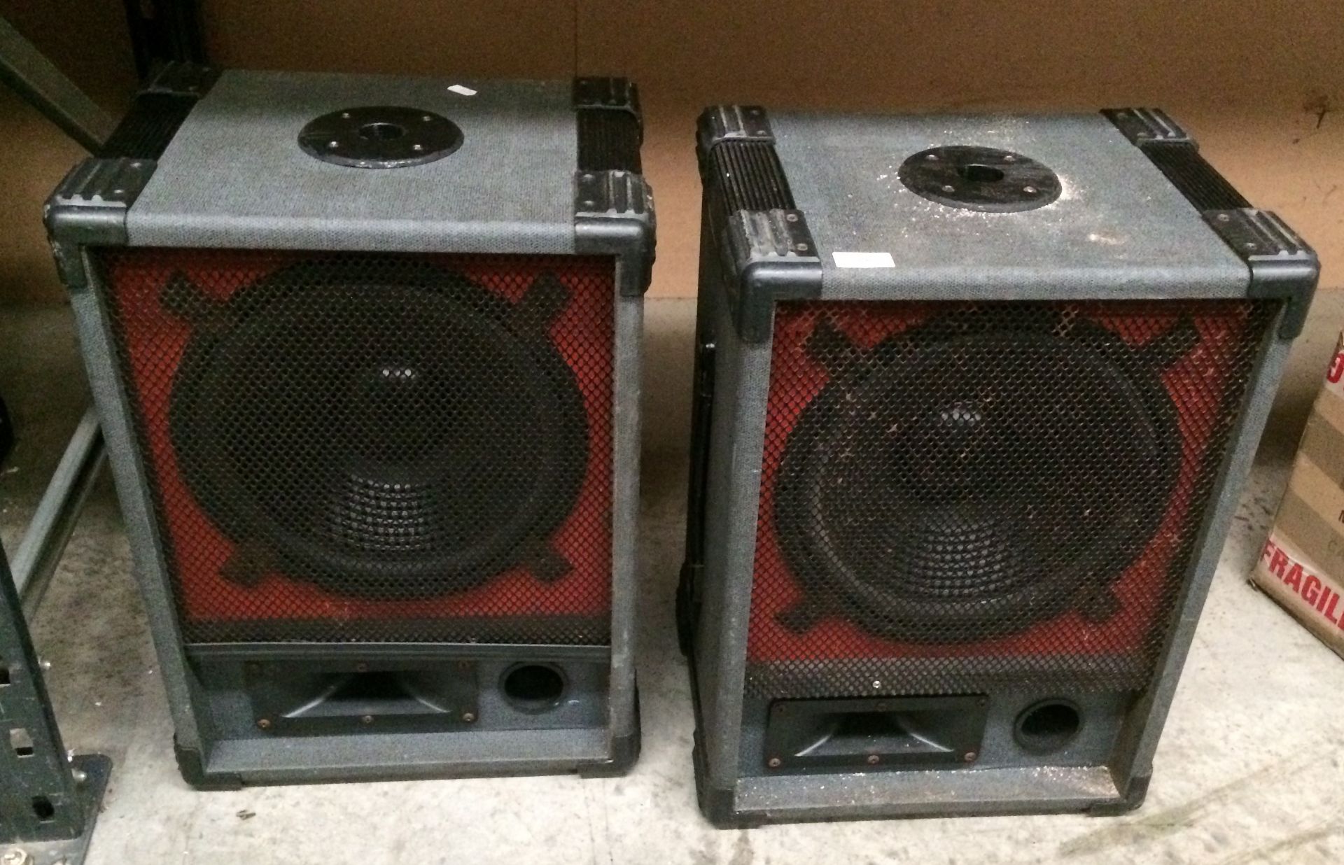 Pair of cased loud PA speakers