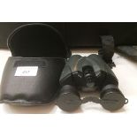 A pair of Pentax 8-16X21UCF zoom binoculars in case