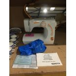 Toyota SE91 RS200 electric sewing machine complete with foot pedal and manual